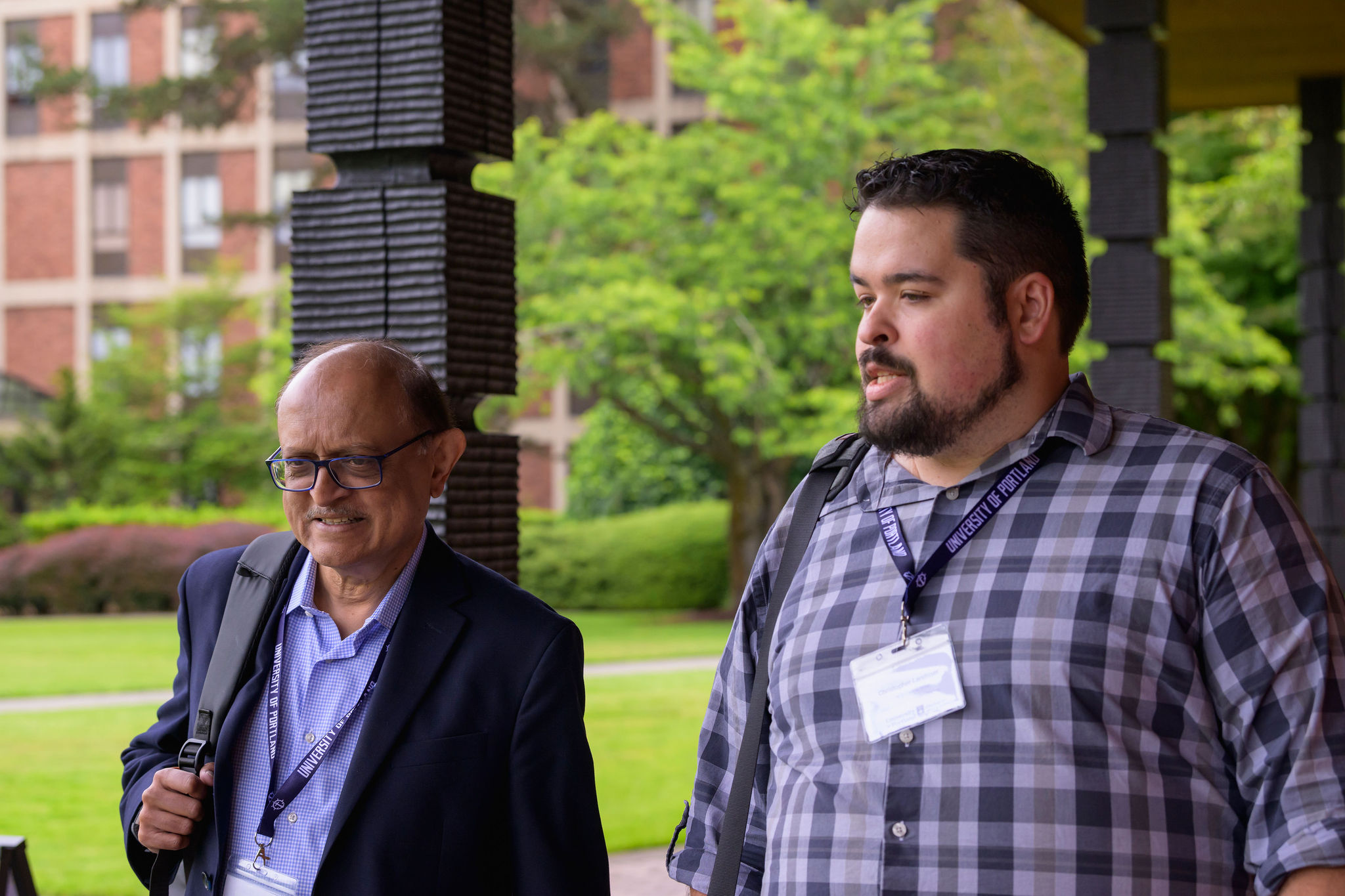 Chris Landtiser in conversation with an attendee at the National Catholic Education & AI Conference